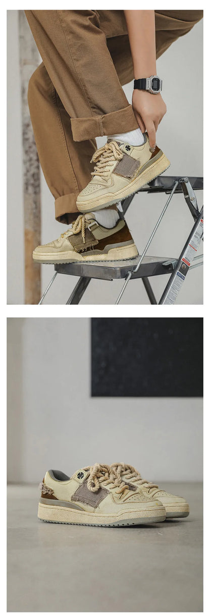 Beige low-top vintage-style skate shoes on a white background, showing round toe and lace-up front.