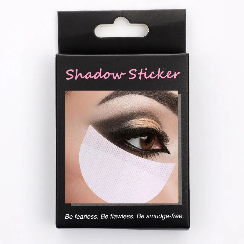 Pack of disposable half-moon shaped under-eye makeup shields on a pink background.