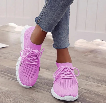 Women's lace-up platform sneaker in multiple colours with a low-top profile and rubber sole.