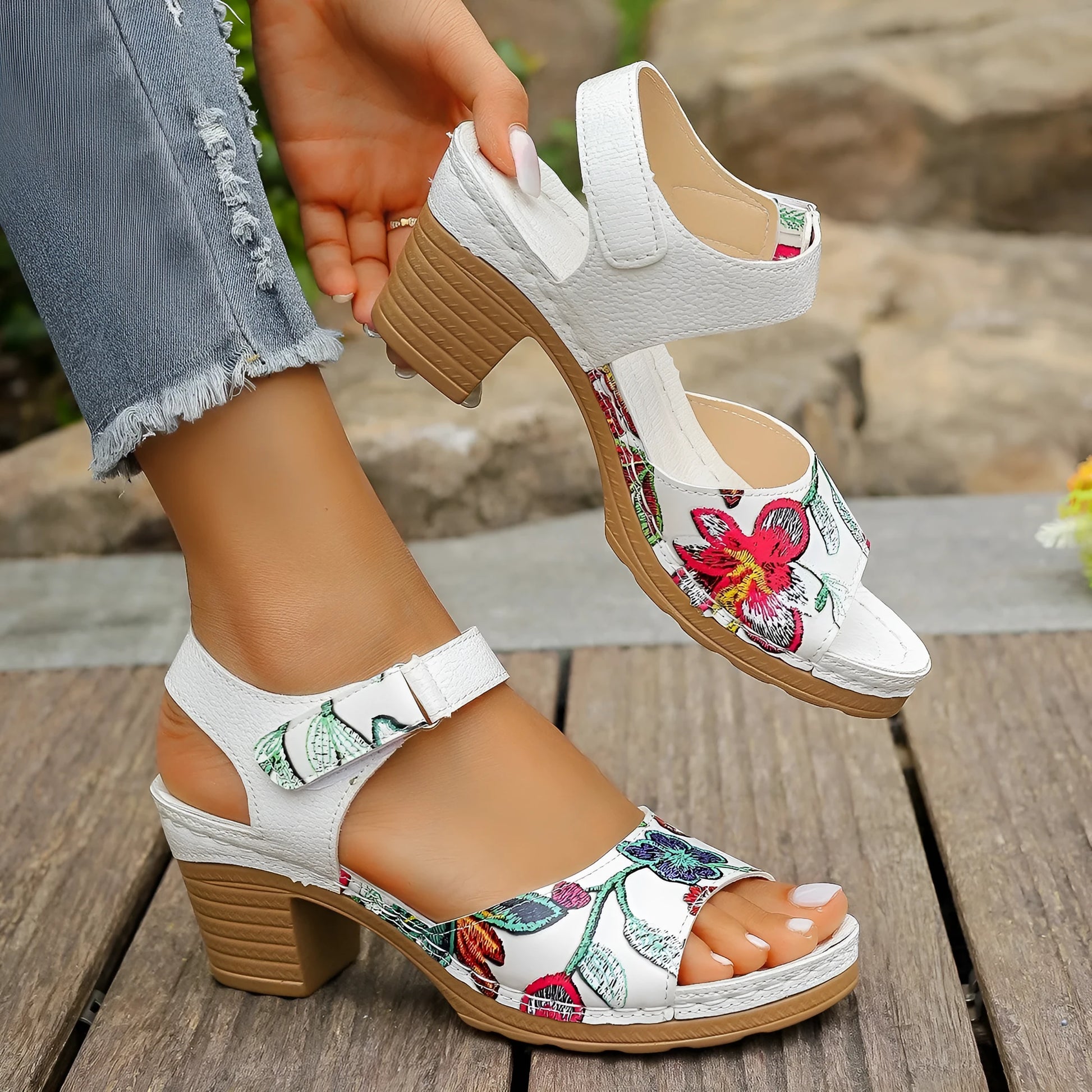 White women's high heel sandals with velcro buckle closure showing PU upper and rubber sole