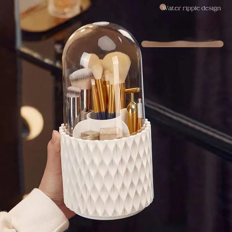 White rotating acrylic makeup brush holder with transparent dust cover on desktop