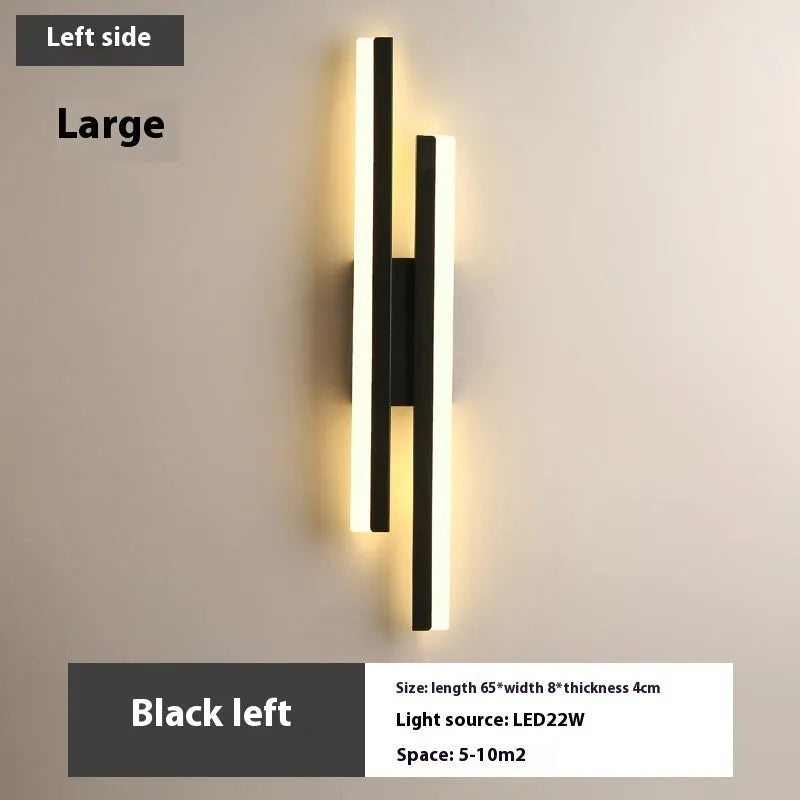 Scandinavian minimalist LED wall light with acrylic shade and adjustable arm in black or gold finish.