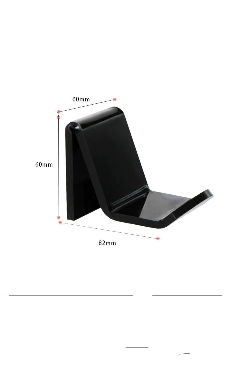 A universal black game controller mounting bracket shown installed on a wall.