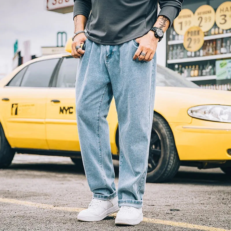 Men's loose straight jeans casual trousers for plus size in dark blue light blue gray colours with inelastic mid waist and zipper fly available in sizes 28 to 48 with simple style and cotton fabric construction