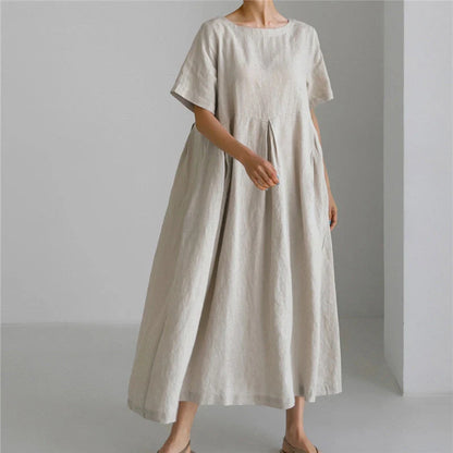 Comfortable cotton linen round neck dress in navy blue, army green, and apricot colors, perfect for casual wear.