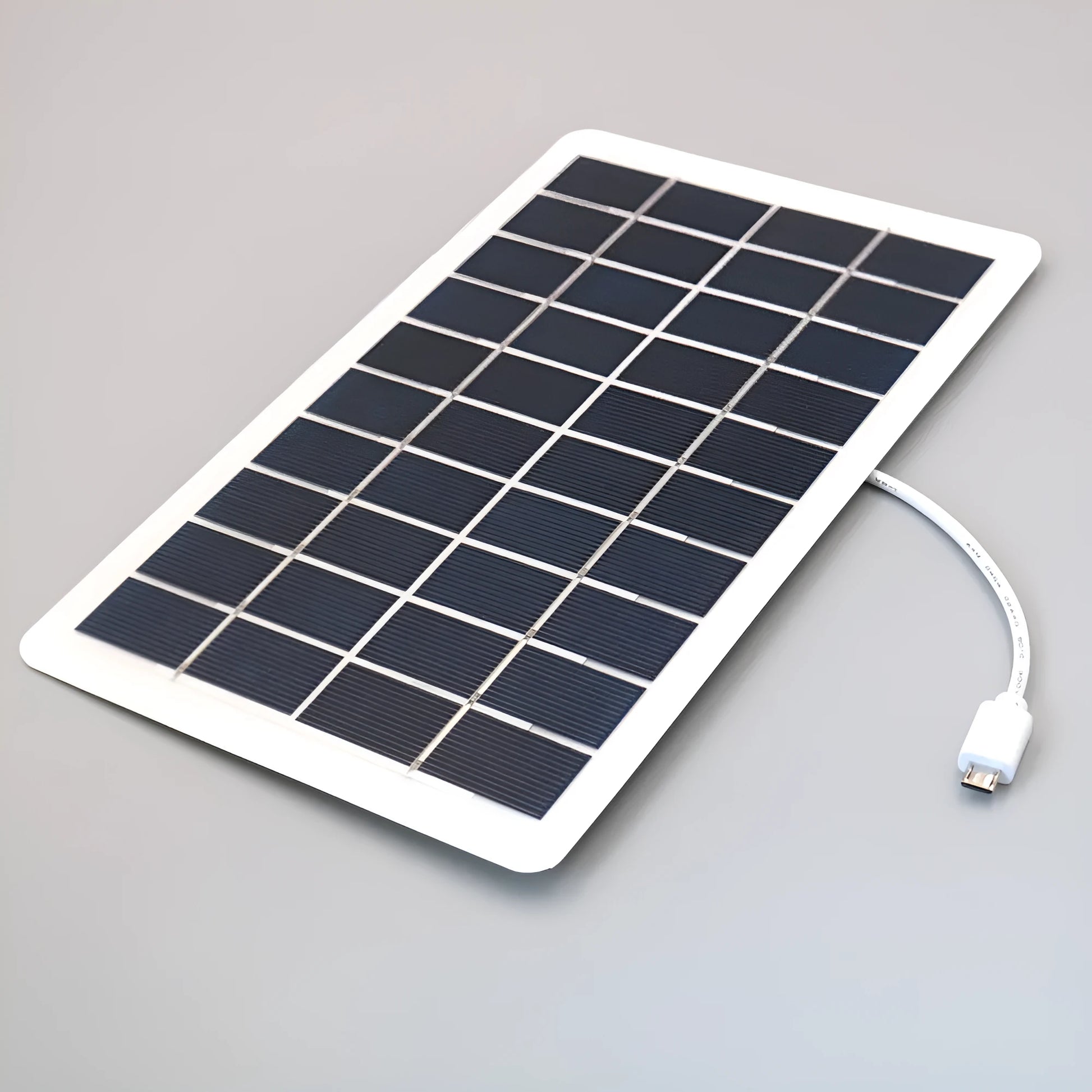 Black solar panel mobile phone charger with USB port showing compact portable design