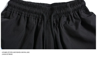 Men's black loose-fit quick-dry sports shorts with elastic waist, shown above the knee.