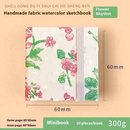 Feiluniao watercolour notebook with fabric cover, 185mm length, open to show paper for painting.