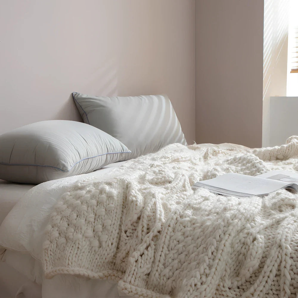 Beige hand-woven acrylic wool blanket 120x150cm 1.7kg on sofa, low 2-3% shrinkage