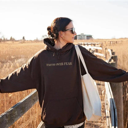 A stylish Christian hoodie with inspirational graphics and a message of faith over fear