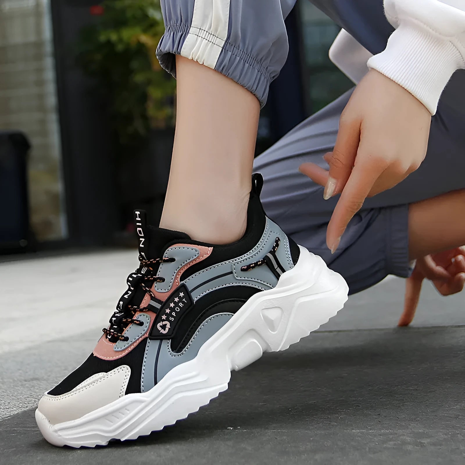 Women's white casual sports shoes with mesh upper, thick sole, buckle strap, and round toe.