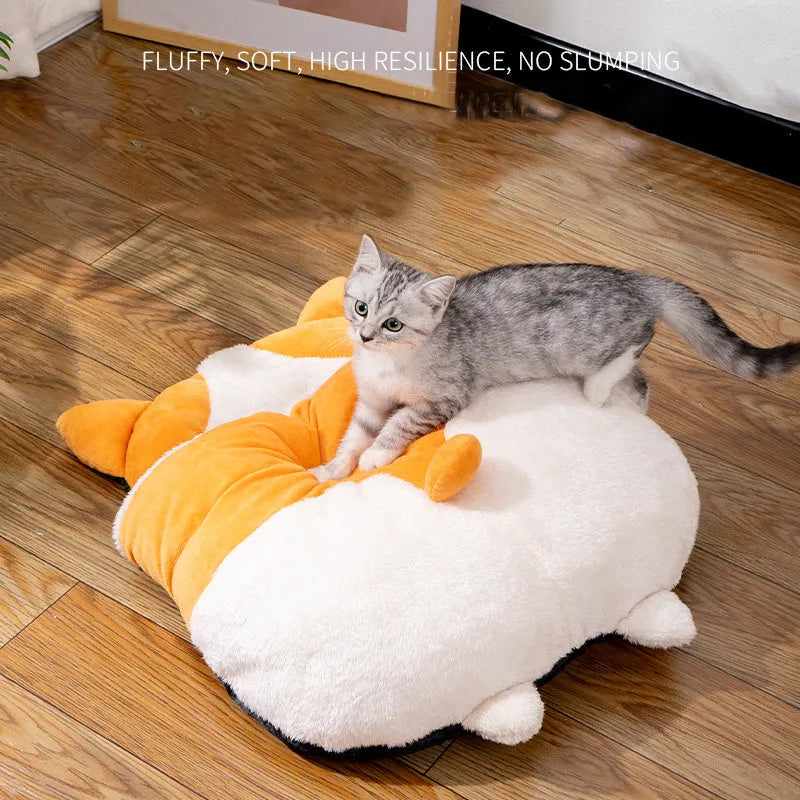 Orange semi-closed sleeping bag bed for cats on a floor, showing soft interior and dimensions.