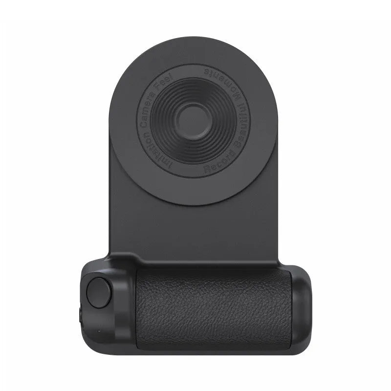 Black magnetic phone camera grip holder with rotatable stand on a table next to a smartphone.