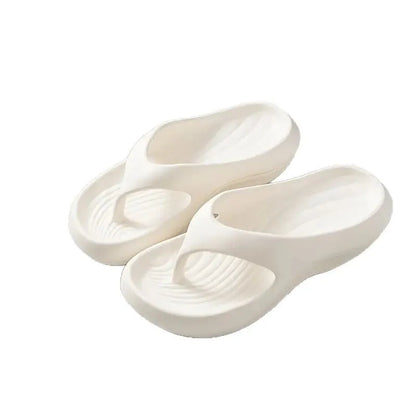 Women's black thick-soled EVA flip-flops with a non-slip pattern on the sole.