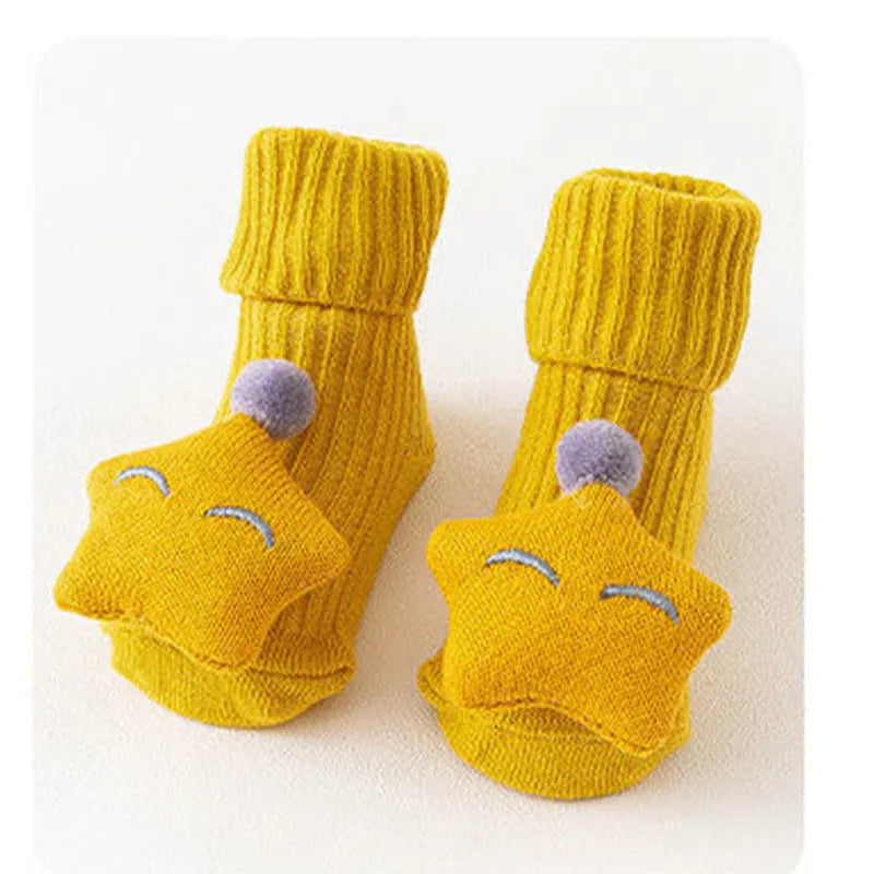Cotton baby floor socks in assorted colours and patterns including bows, stars, and animal designs.