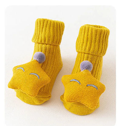 Cotton baby floor socks in assorted colours and patterns including bows, stars, and animal designs.