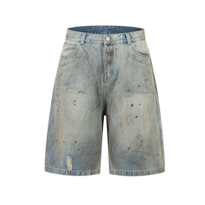 Blue denim cropped middle pants with straight-leg style and zipper fly closure on a street fashion background