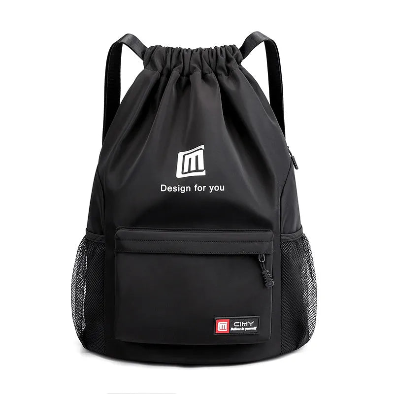 Large bucket-shaped travel backpack in blue with drawstring closure and soft black shoulder straps.