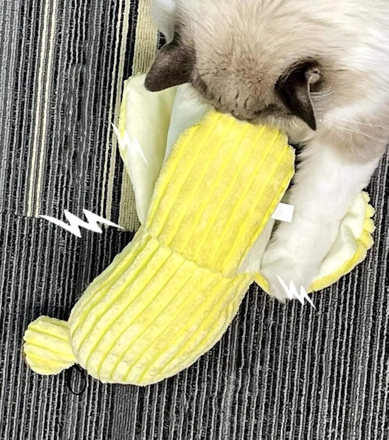 Yellow banana-shaped plush cat toy with a green leaf and crinkle paper inside for sound.