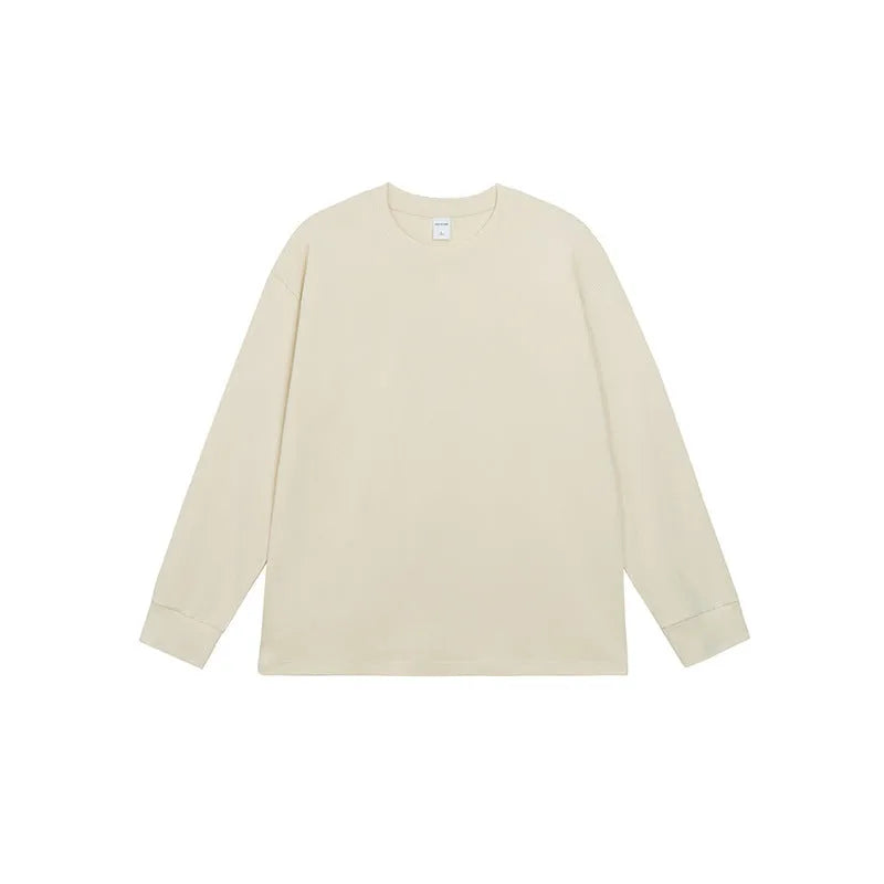 Man wearing a simple solid colour long sleeve cotton t-shirt in a loose, casual fit.