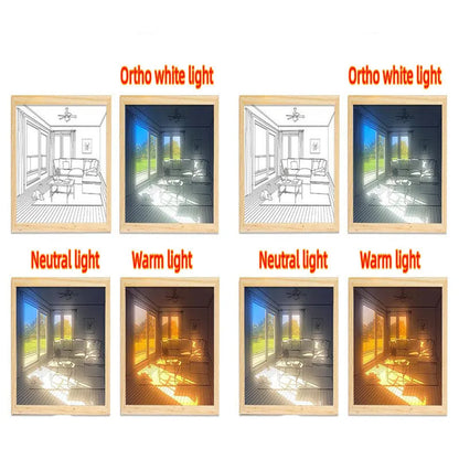 LED illuminated decorative picture light on a table showing a scenic landscape image glowing from within.