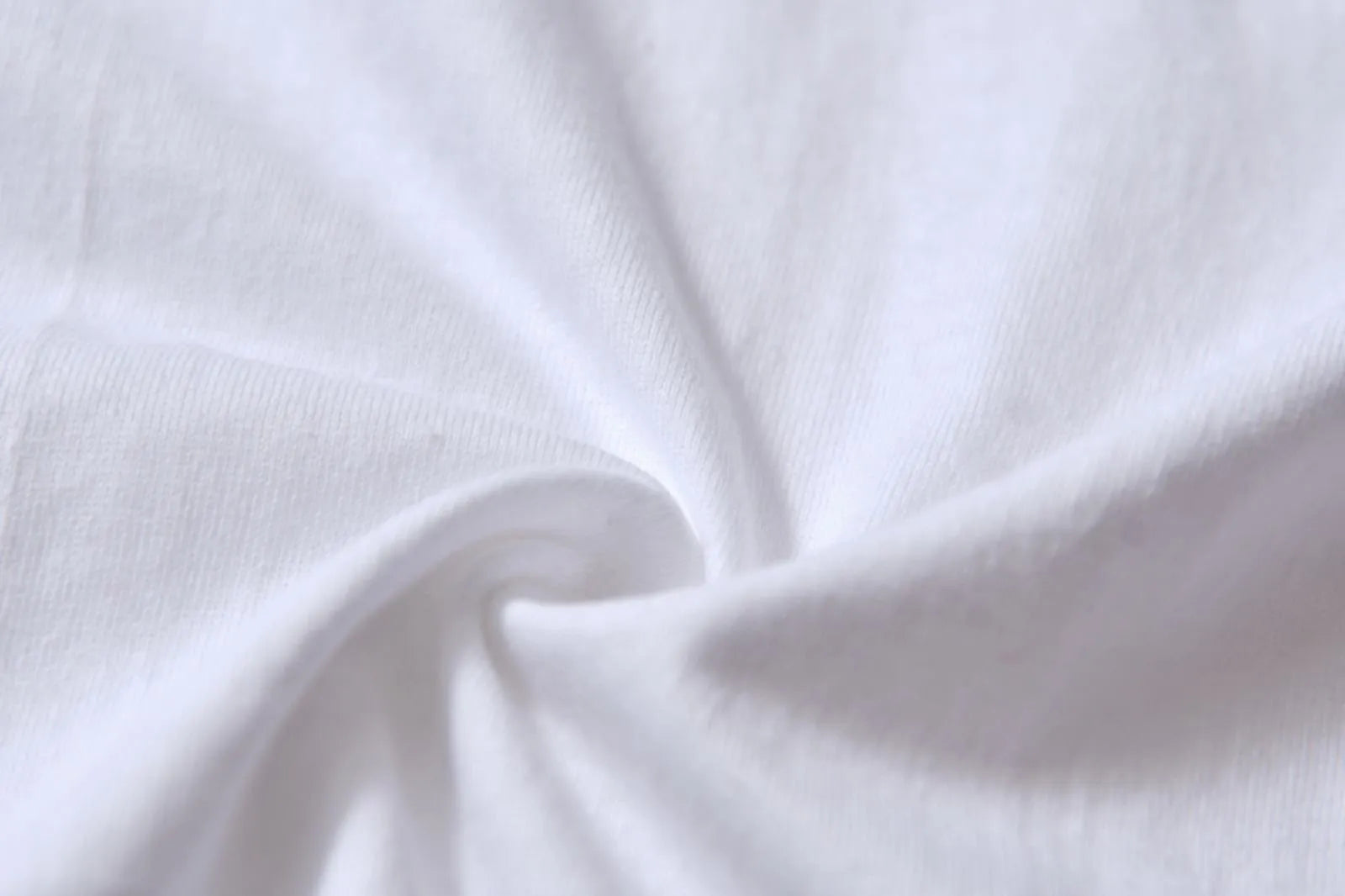 White cotton pullover overalls with a pattern, short sleeves, and a round neck on a teenager.