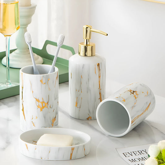 White ceramic bathroom wash kit set with cups, latex bottle and soap box in packaging.