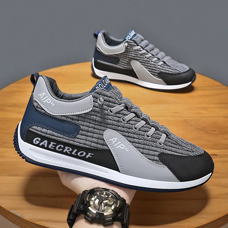 Men's grey and green mesh running shoes with lace-up front and low-top ankle design