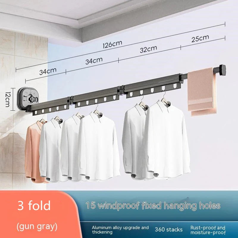 Aluminum retractable drying rack mounted on a window, extending outward for clothes drying