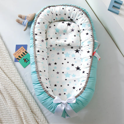Portable foldable baby bed measuring 85x45cm with cartoon pattern, shown in green elk design