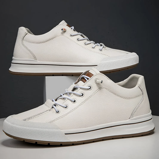 Men's white and black matte leather casual shoes with flat heel on a plain background, showing round toe shape.
