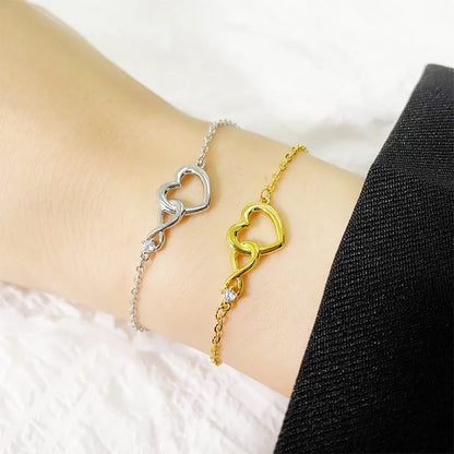 Heart-shaped bracelet with 3A zirconia in platinum and golden colors