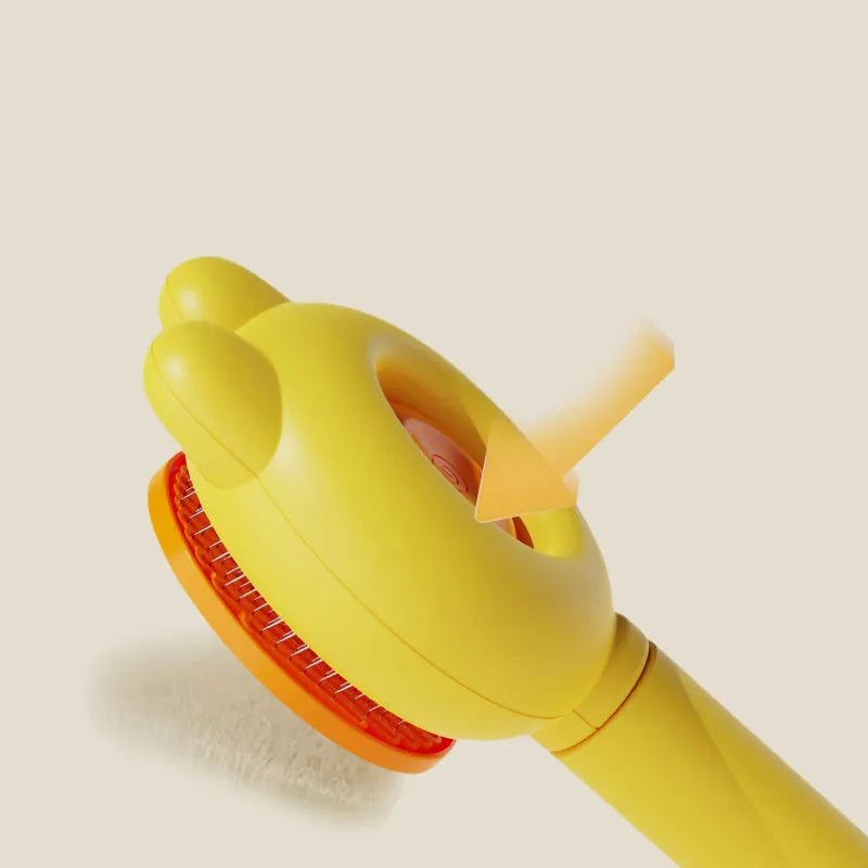 Green self-cleaning pet grooming brush with a release button and rubber-tipped metal pins on a non-slip handle.