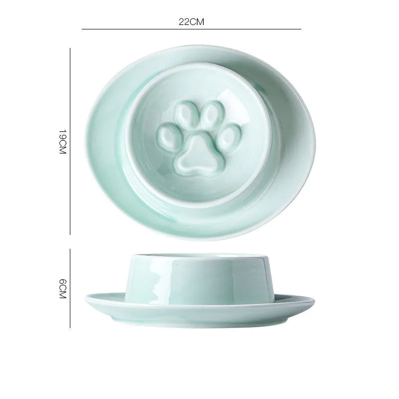 Green ceramic slow feeder bowl for pets with high walls and a non-slip rubber base.