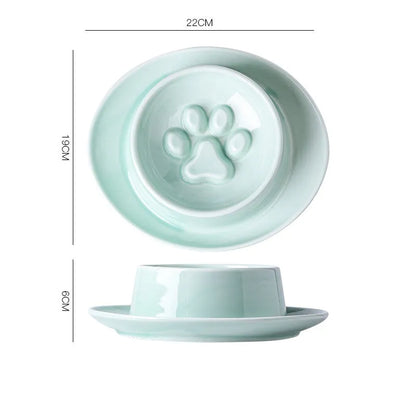 Green ceramic slow feeder bowl for pets with high walls and a non-slip rubber base.