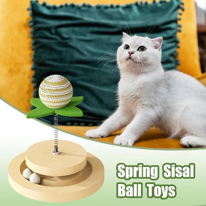 Green sisal scratching pad cat toy with rotating ball track and spring elements for indoor feline play