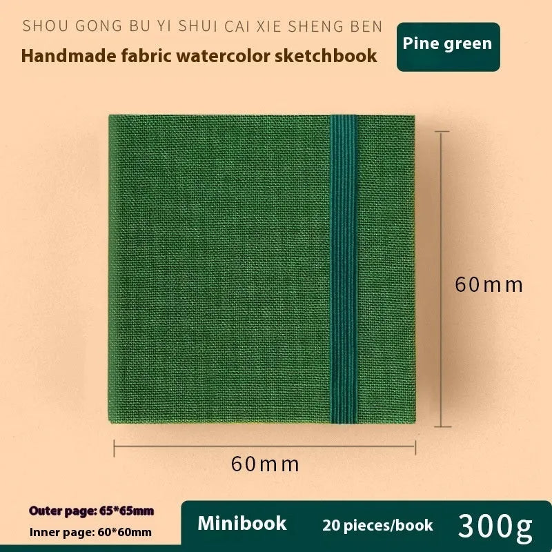 Feiluniao watercolour notebook with fabric cover, 185mm length, open to show paper for painting.