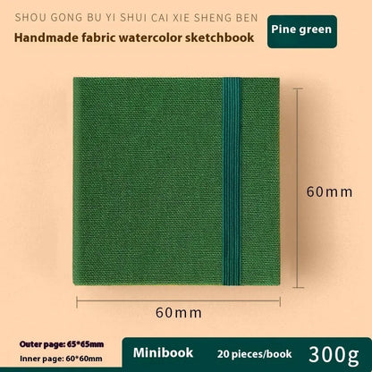 Feiluniao watercolour notebook with fabric cover, 185mm length, open to show paper for painting.