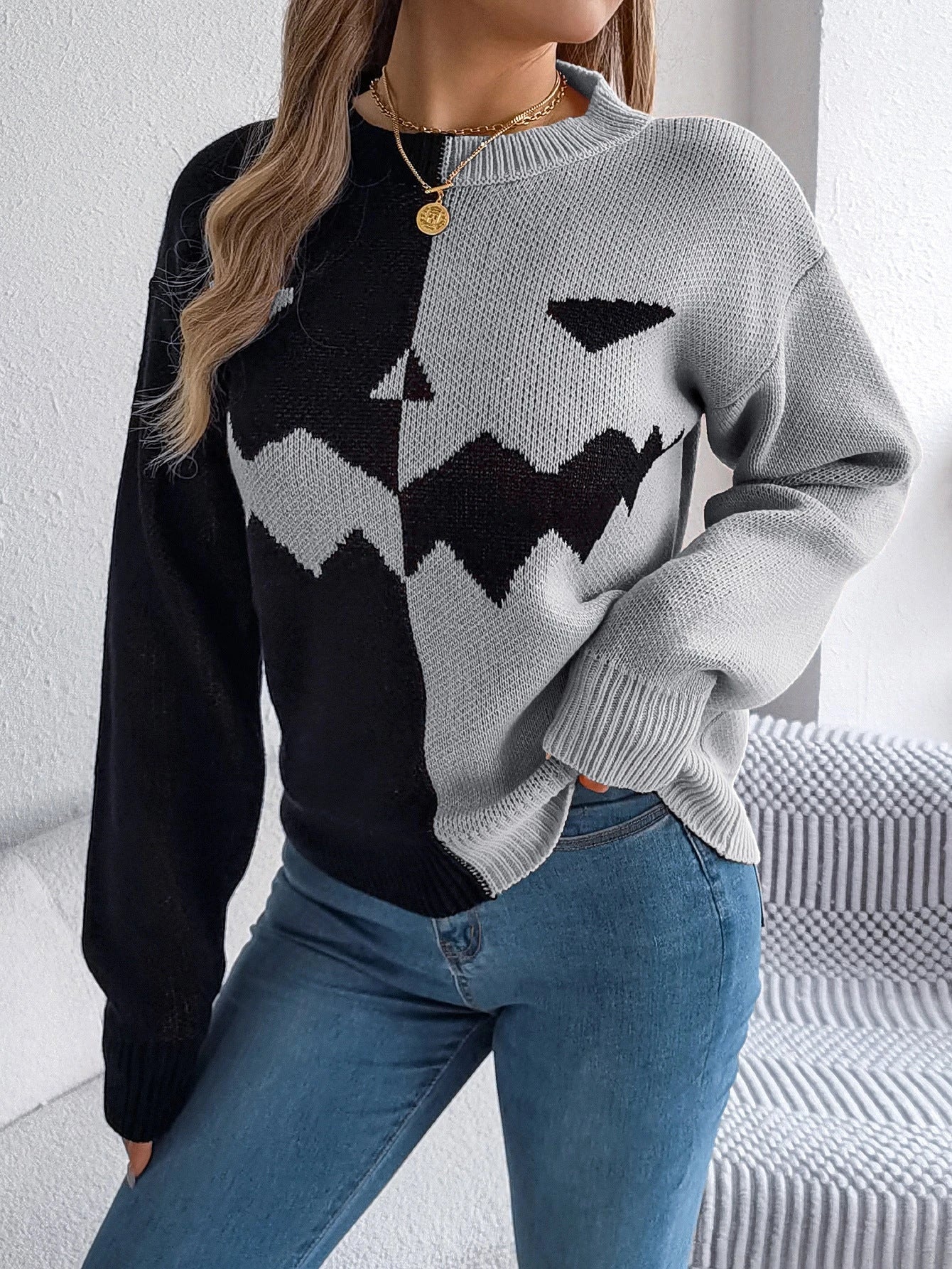 Cozy Halloween pullover sweater with ghost pattern in orange, khaki, and grey colors