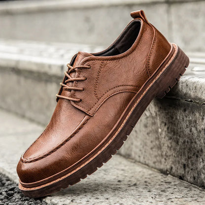 Brown casual leather shoes with round toe, flat heel, and visible sewing lines on the cowhide upper.