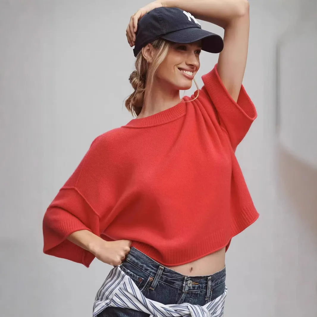 Red short viscose T-shirt with an exposed navel design on a mannequin.