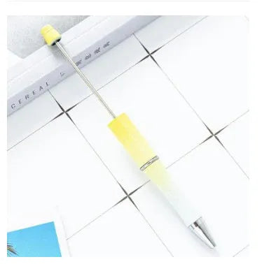 Rotating bead ballpoint pen in gradient colour with ABS plastic and steel wire construction