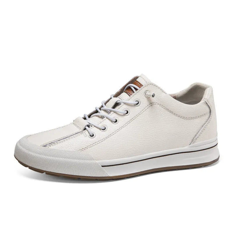Men's white matte leather trainers with a flat sole and round toe on a plain background