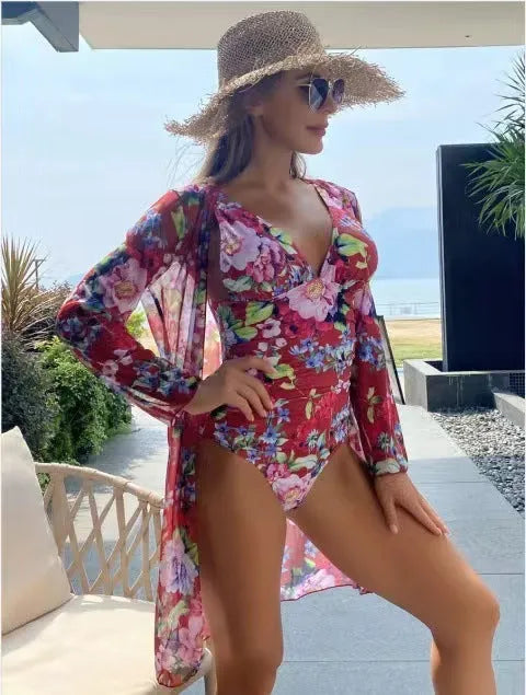Women's floral print bikini three-piece swimsuit set with matching coat in a selection of colours.