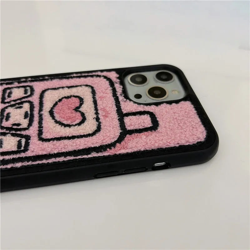 Pink soft TPU iPhone case with a towel-embroidered textured back for models iPhone X to 15.