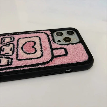 Pink soft TPU iPhone case with a towel-embroidered textured back for models iPhone X to 15.