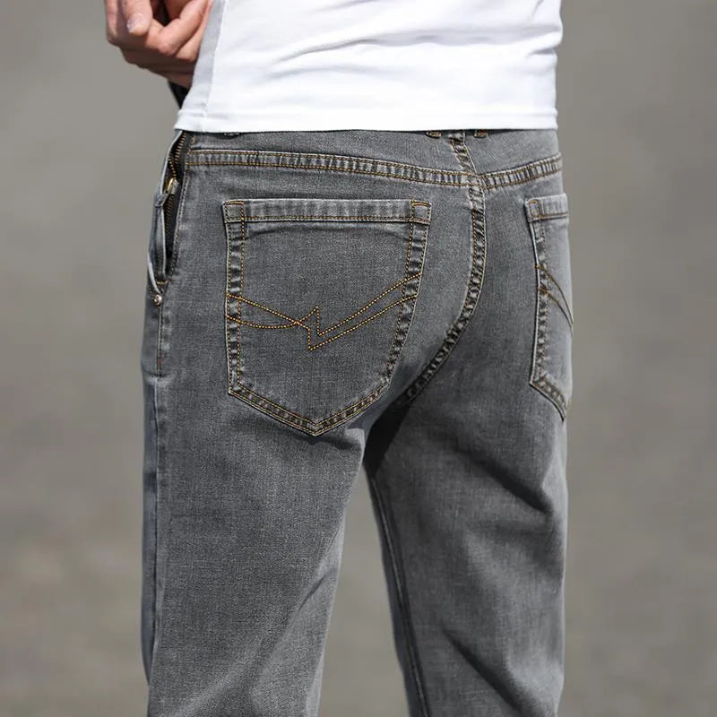 Smoky gray men's straight leg jeans with rabbit fur fabric on a hanger.
