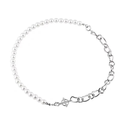 White geometric acrylic asymmetric clavicle chain necklace on a twisted chain.
