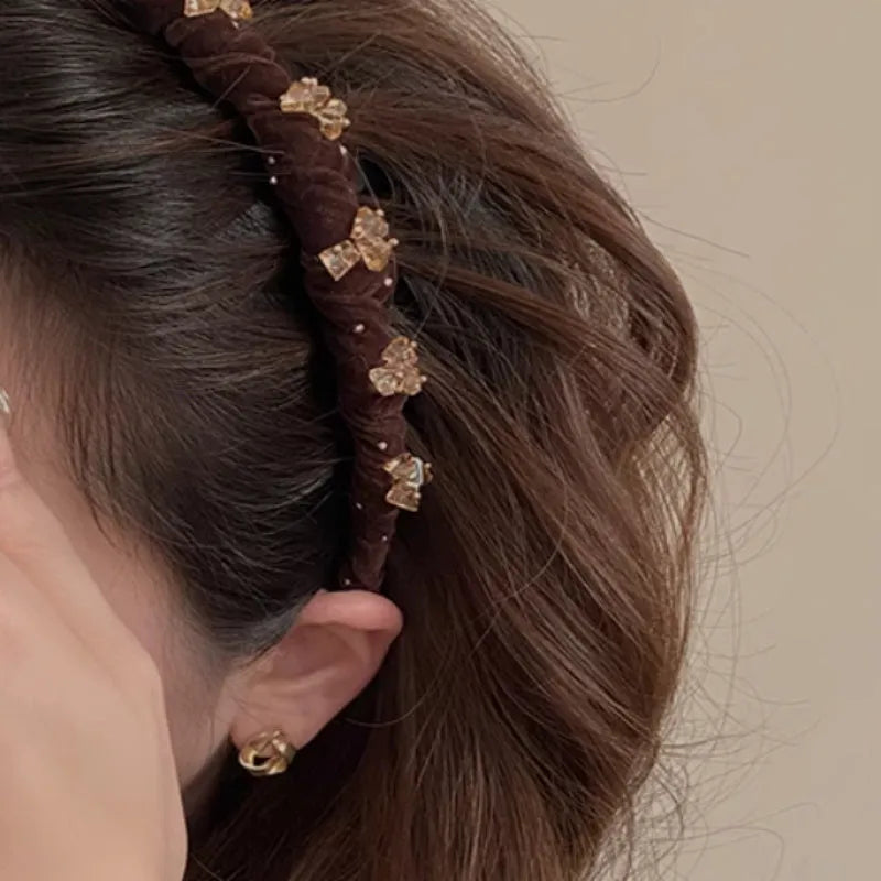 Velvet and crystal embellished high-head hairband in a choice of colours on a white background.