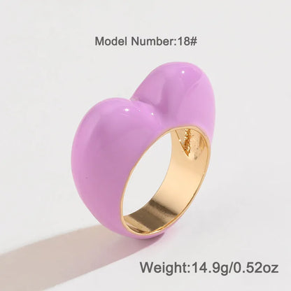 Heart-shaped enamel ring with three-dimensional detail in black, pink, purple, or red, sized for fingers 17-18